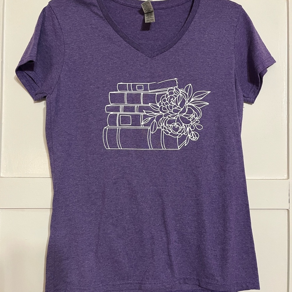Purple tshirt with book and flower print